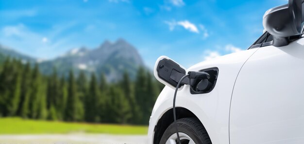 Focus closeup EV car and charger with cordial blur background