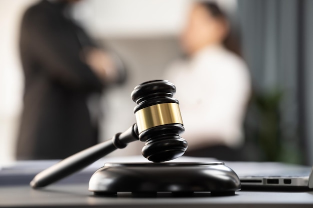 Focus closeup wooden gavel on blur background of legal team Equilibrium