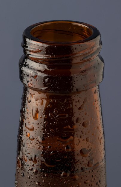 Focus on cold beer isolated on blue background