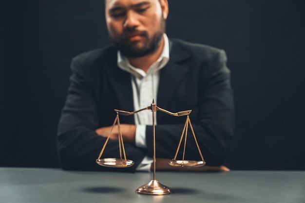 Focus golden scale balance with burred background of lawyer equility