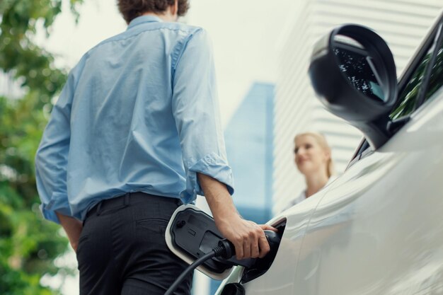 Focus hand insert progressive ev charger with blurred background