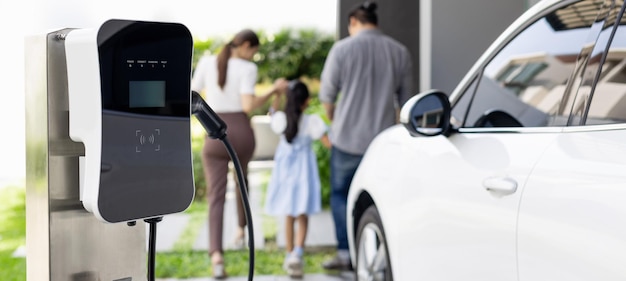 Focus home charging station for EV car blur progressive family in background