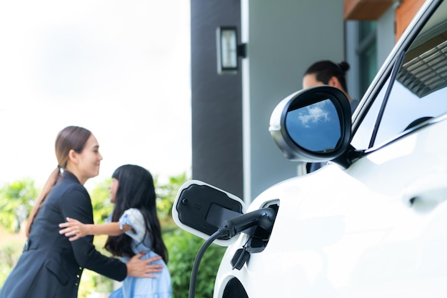 Focus home charging station for EV car blur progressive family in background