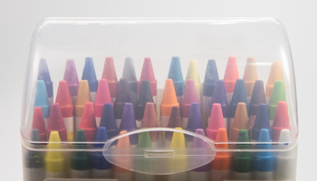 focus inside plastic box of colorful of crayon