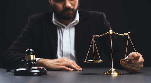 Focus symbols of justice on blurred background of lawyer equility