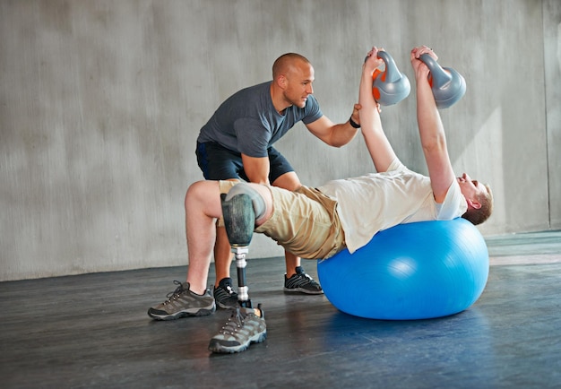 Focus on the upper body Studio shot of a young amputee training in a gym