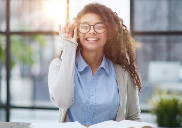 Focused agent girl lawyer manager sitting at workplace