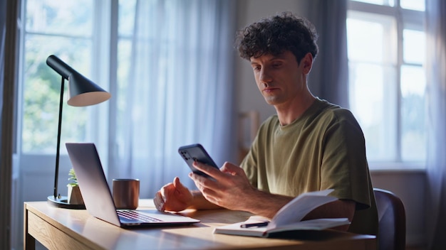 Focused businessman receiving notification at laptop table workplace closeup