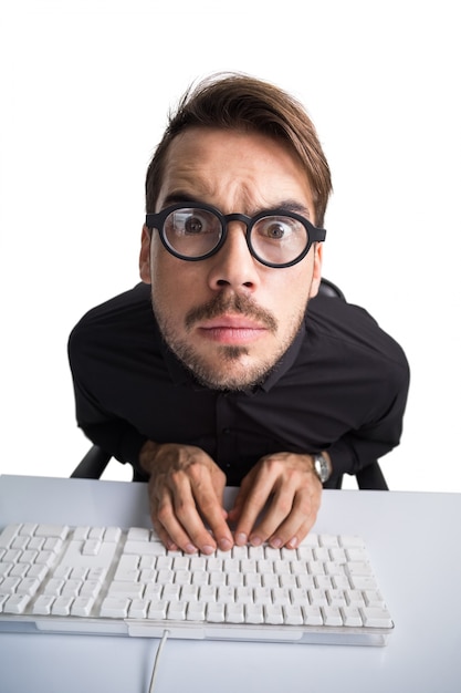 Focused businessman in shirt using computer