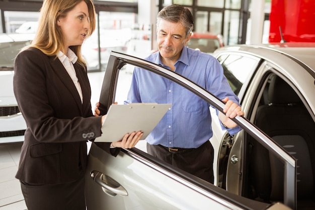  Focused businessman undersign a car contract