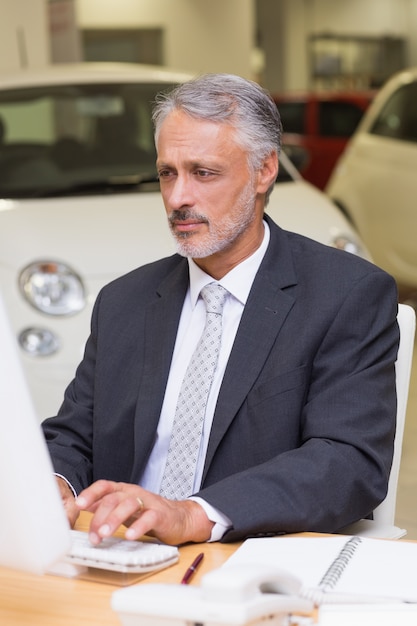 Focused businessman working on computer