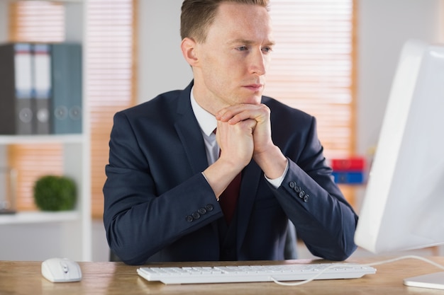 Focused businessman working at his desk