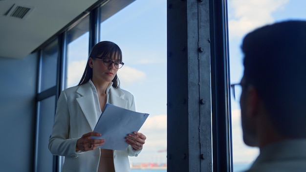 Focused businesswoman checking documents in office Finance business team work