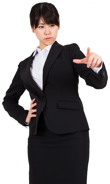 Focused businesswoman pointing