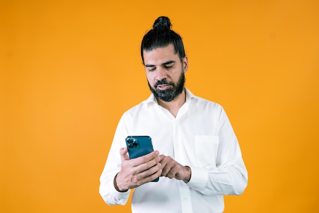 Focused ethnic manager using smartphone