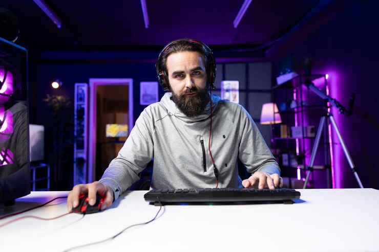 Photo focused gamer discussing with teammates while playing videogame