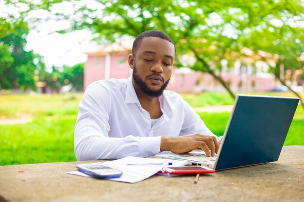 Focused handsome man working on his project