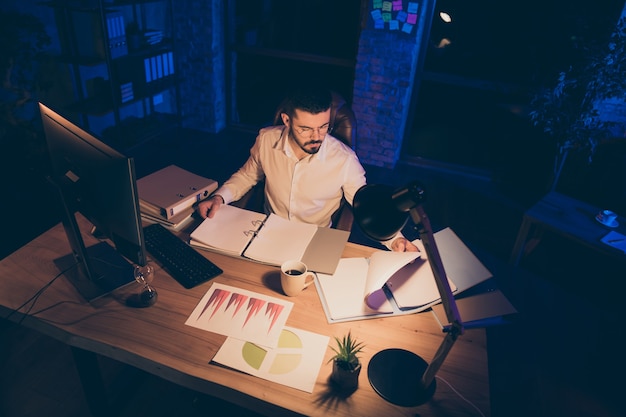 focused man sit table busy work