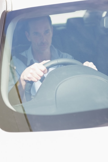 Focused man sitting at the wheel