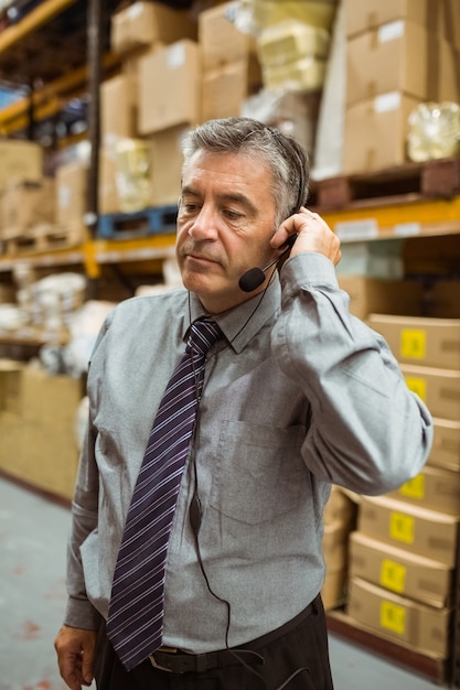 Photo focused manager talking in a headset