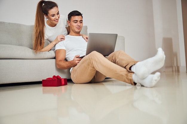 Focused married couple surfing the net together