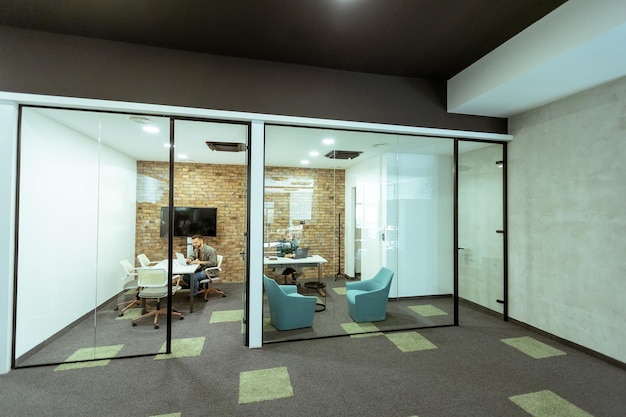 Photo focused work in a modern glasswalled office