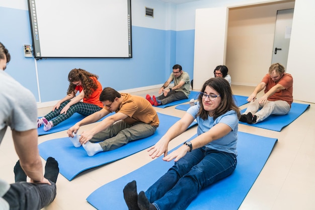Focused yoga session for people with mental disabilities including down syndrome