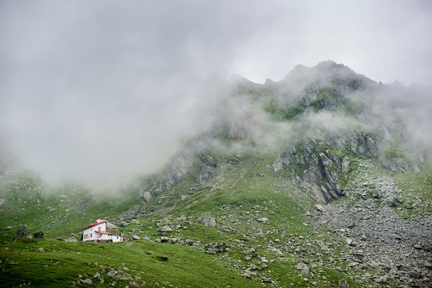 Fog descends to mountains in valley of Fagaras Mountains