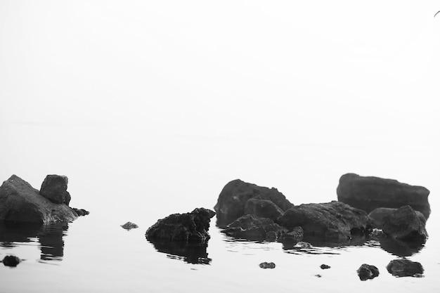 Fog in the lake. Morning nature water and white fog.