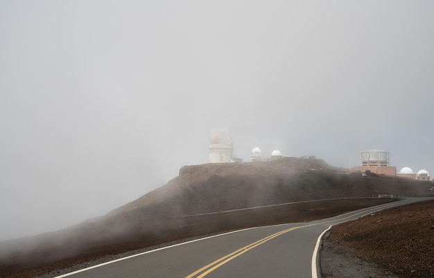 Fog shrouds the telescopes on the top of Haleakala Maui