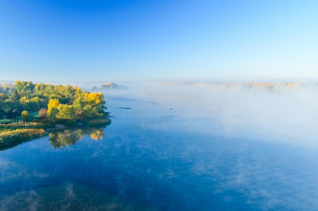 Fog over the water on a river Dnieper on autumn