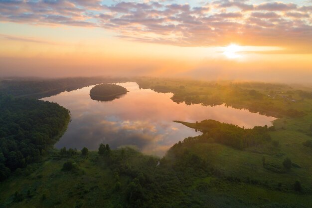 Foggy morning at beautiful lake in Belarus