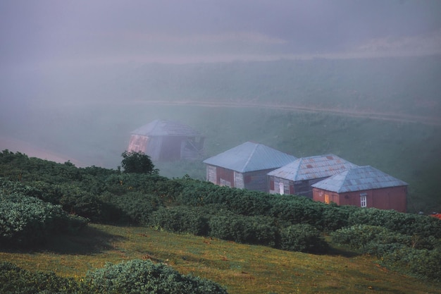 Foggy mountain village at sunset