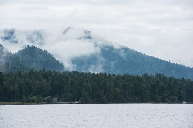 Foggy mountains near the lake