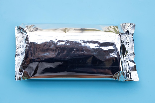 Foil package bag on blue background