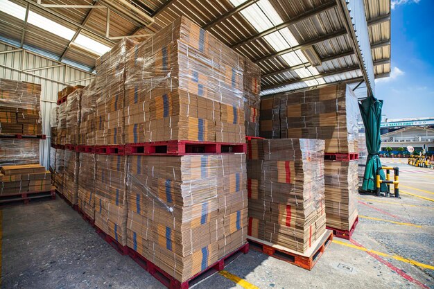 Folded cardboard boxes in the warehouse Stack of flat industrial folding cardboard