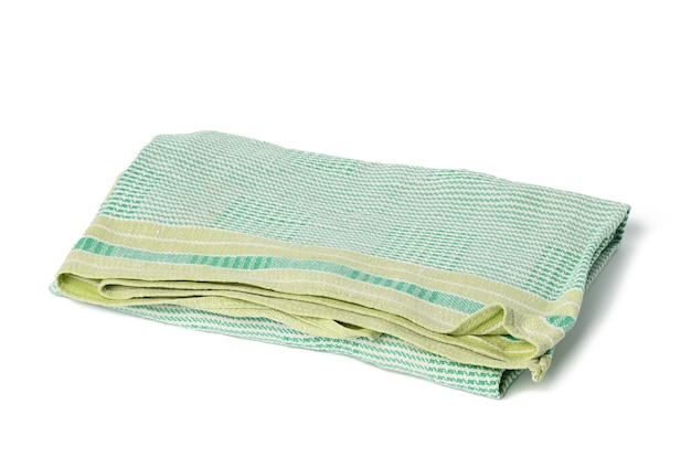 Folded green linen towel on white background, top view