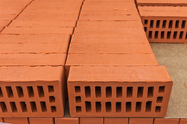 Folded red bricks in the building store