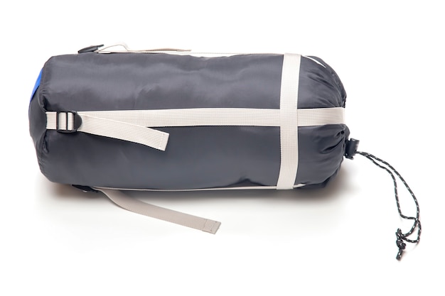 Photo folded sleeping bag on a white. items for tourism and camping