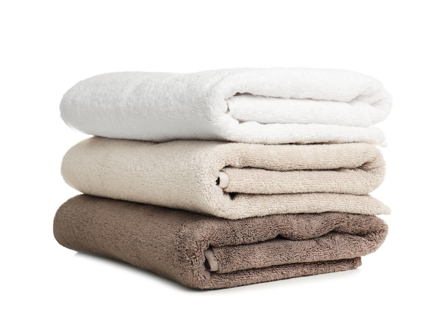 Folded soft terry towels on white background