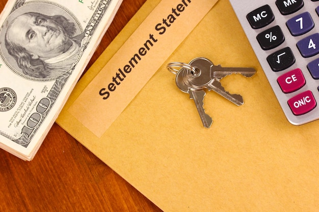 Folder with the settlement statement on wooden background closeup