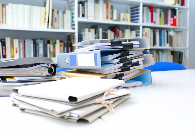 Folders with documents on table in archive