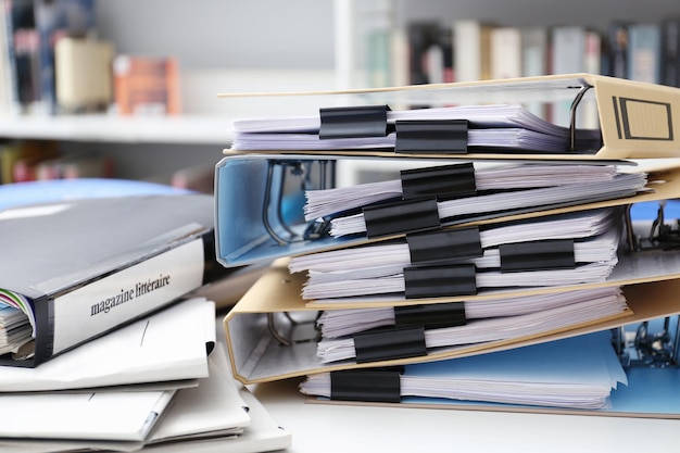 Folders with documents on table in archive