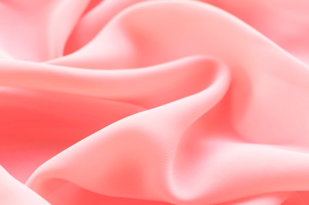 folds of pink coral silk fabric