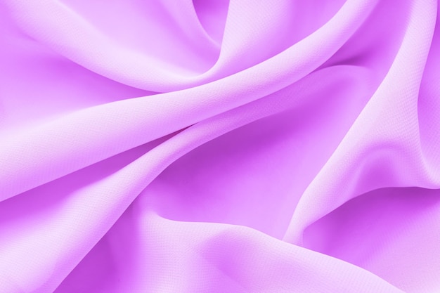 складки фиолетового шелкового фона текстуры ткани