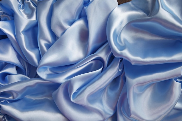 Folds of silk airy light blue color top view