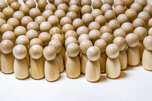 Follow the leader or human resource management concept crowd of wooden people