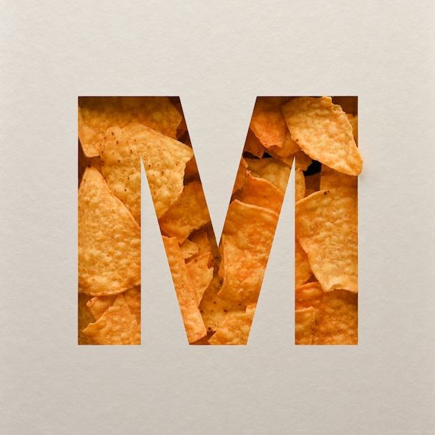 Photo font design, abstract alphabet font with triangle corn chips, realistic leaves typography - m