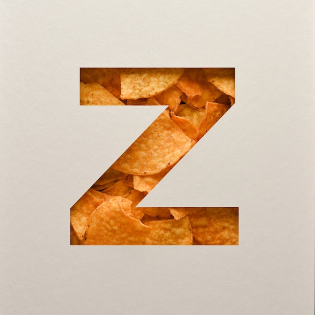 Дизайн шрифта, абстрактный шрифт с треугольными кукурузными чипсами, реалистичная типография с листьями - Z