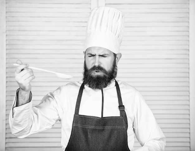 Food aesthetics Bearded man cook in kitchen culinary Dieting and organic food vitamin Chef man in hat Secret taste recipe Healthy food cooking Vegetarian Mature chef with beard